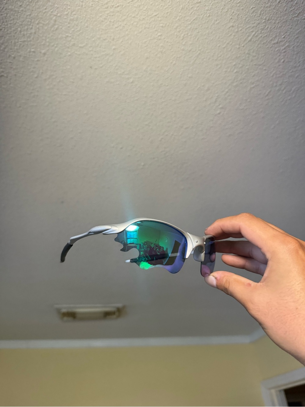 Oakley Silver Frame Sunglasses with Green-Blue Mirrored Lenses